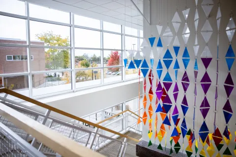 Image of stairwell with art installation.