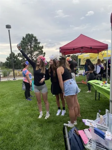 Photo of happy people on grass