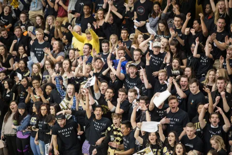 Crowd of students cheering 