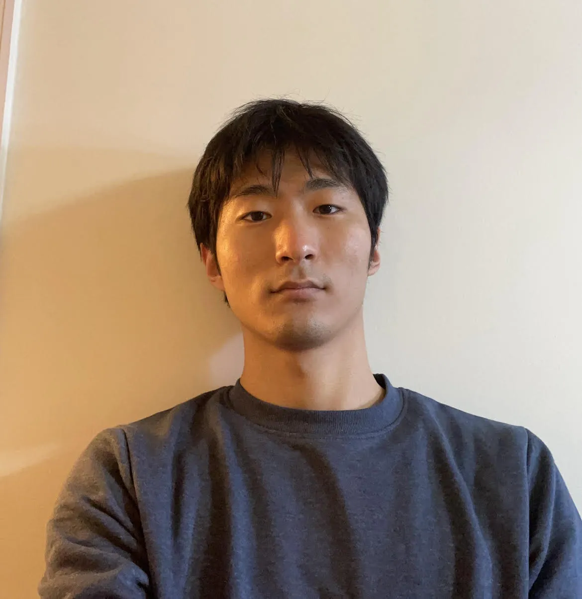 Image of Peter against a white wall