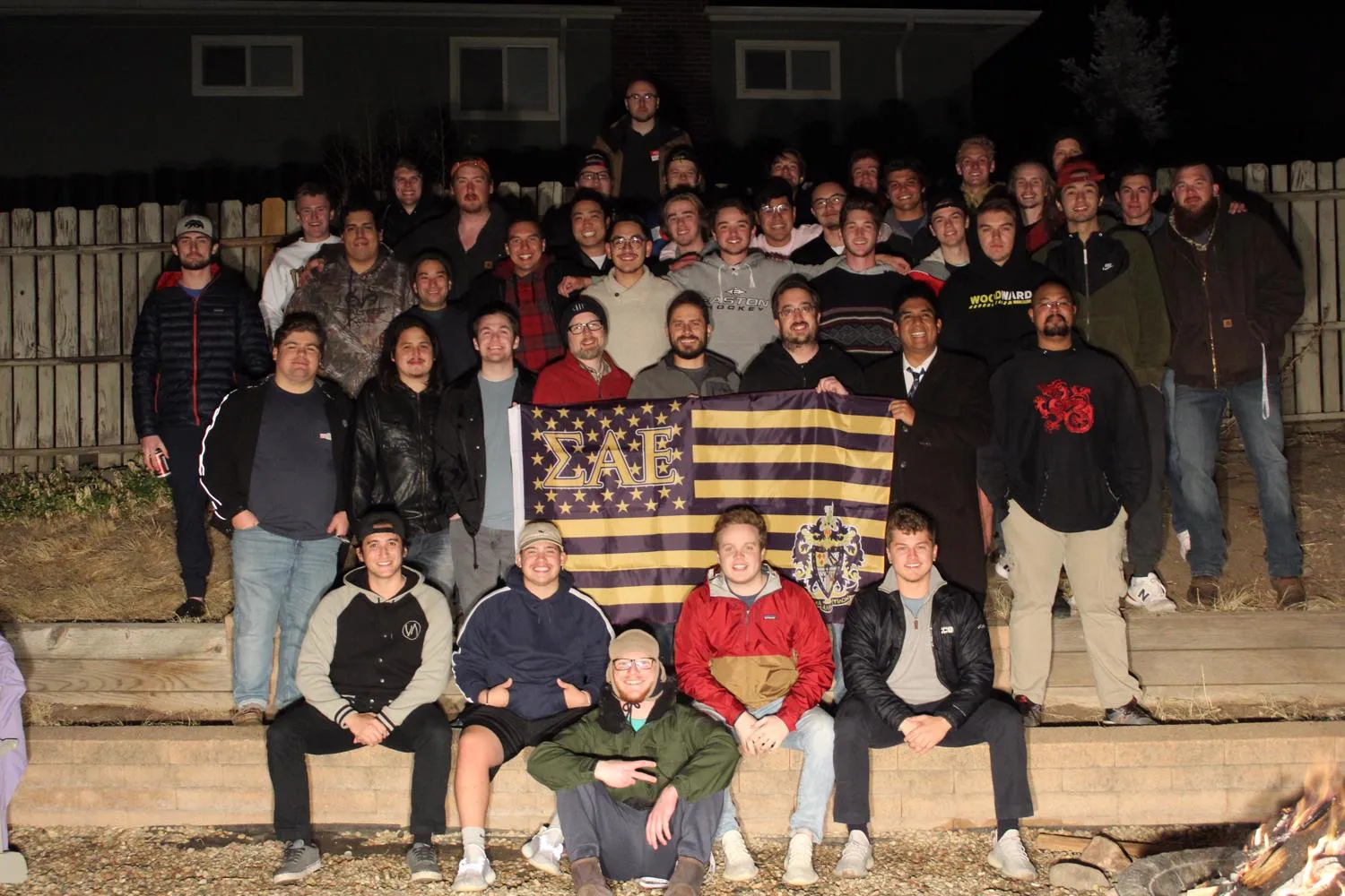 image of a group holding a flag