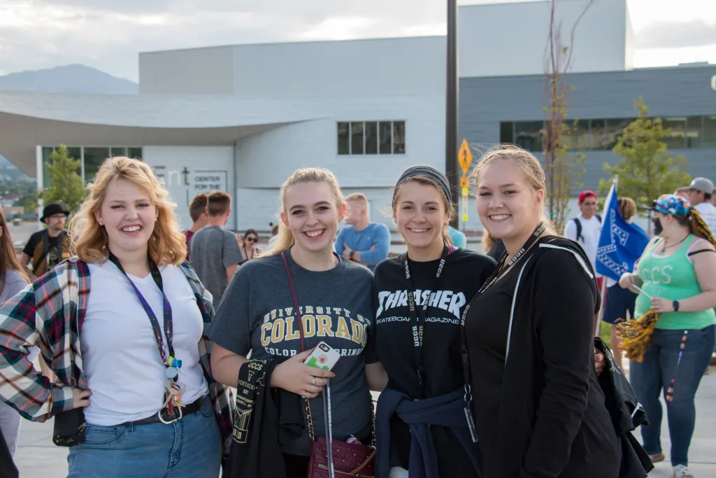 Four students at a UCCS tailgate